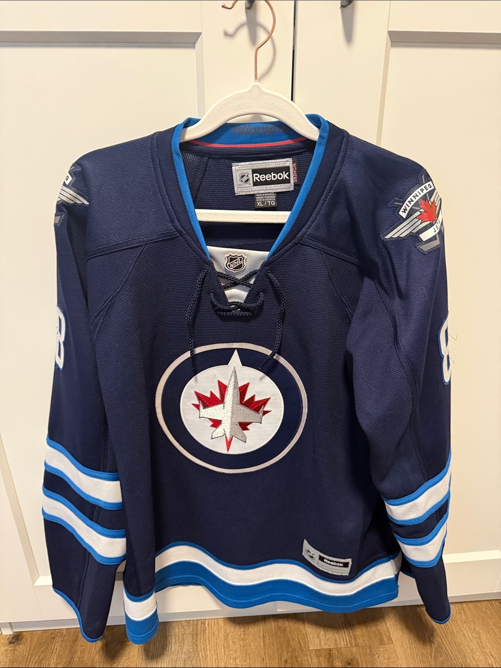 Reebok Navy Blue Winnipeg Jets Hockey Jersey with White and Red Logo
